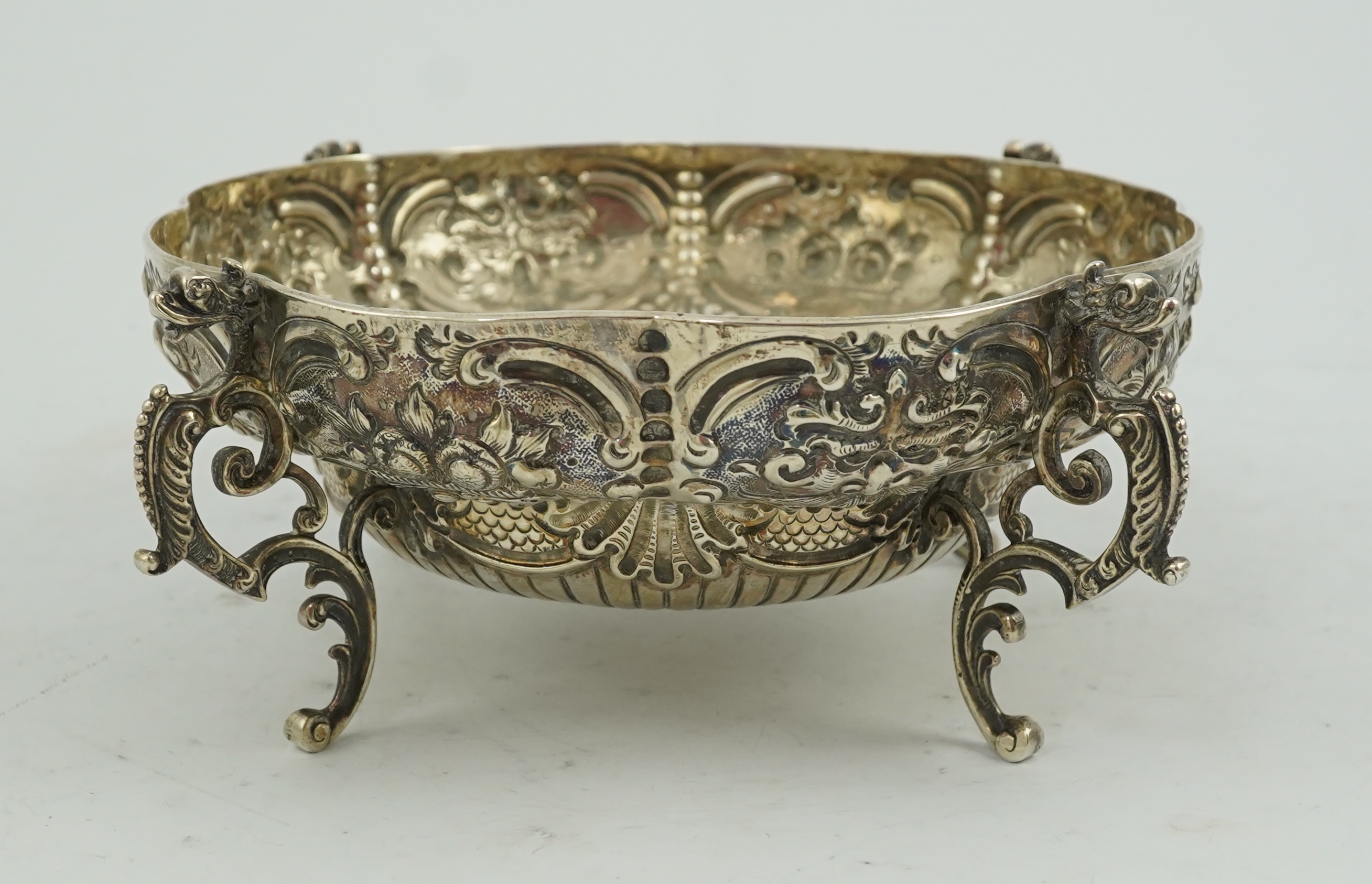 A late Victorian embossed lobed silver bowl, by Goldsmiths & Silversmiths Co Ltd?